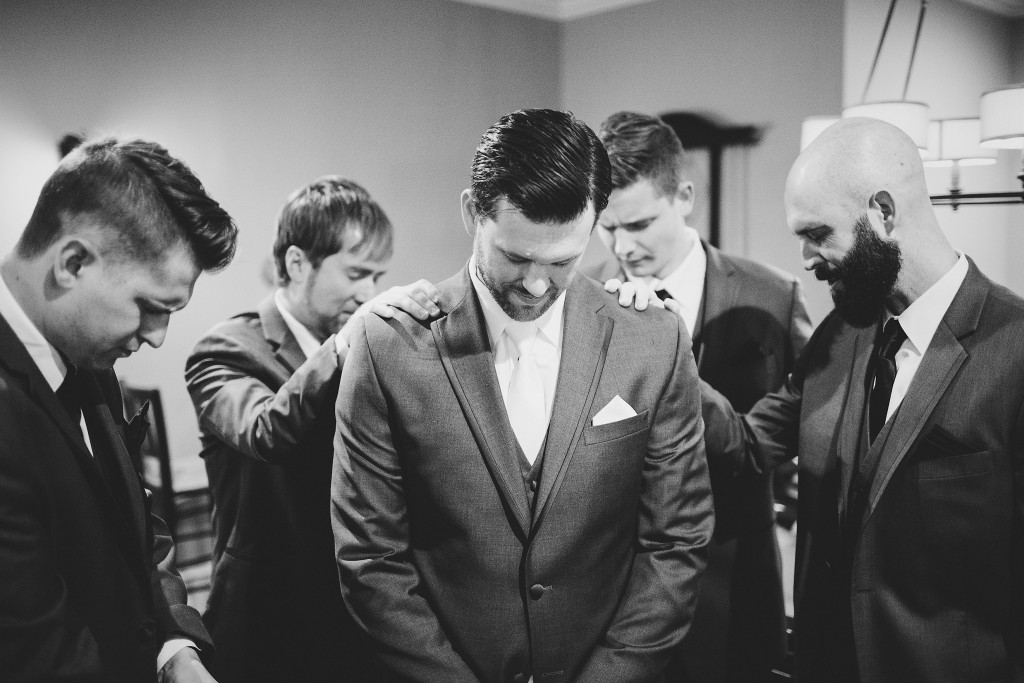groomsmen praying